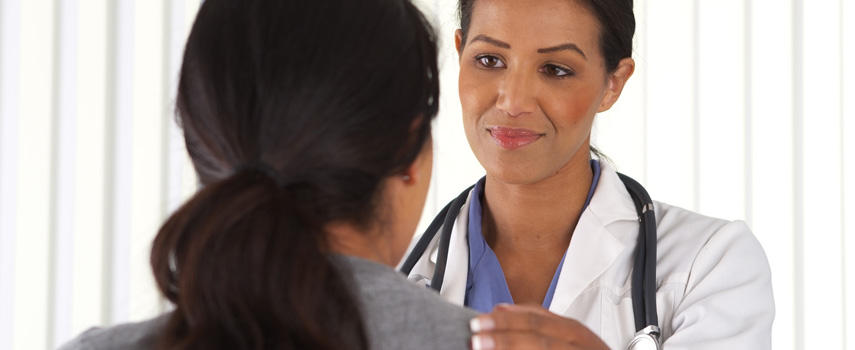 Female physician consulting with a patient